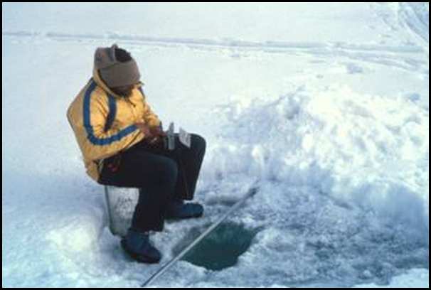 John Goodman fishing on the ice in Greely Fiord